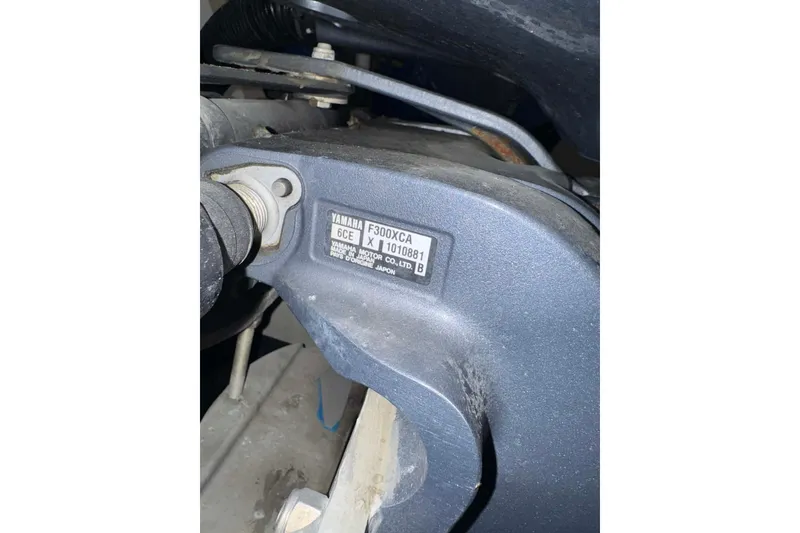 Slide: The Image of Close-up of Yamaha F300XCA engine part on 2005 Contender 23 CC boat. - 12
