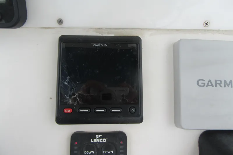 Slide: The Image of Garmin marine electronics on 2005 Contender 23 CC boat dashboard. - 20