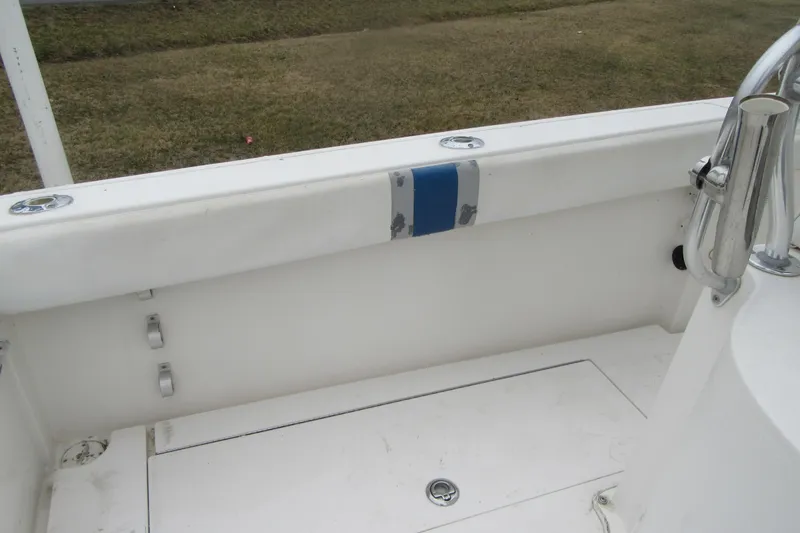 Slide: The Image of 2005 Contender 23 CC boat interior with white deck and stainless steel fittings. - 25