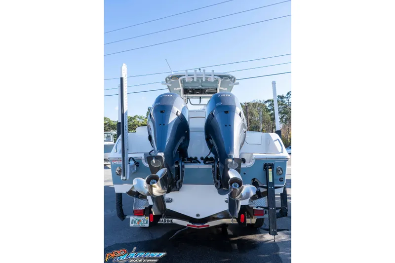 Slide: The Image of 2021 Sea Hunt Ultra 265 SE boat with dual outboard motors, rear view. - 10