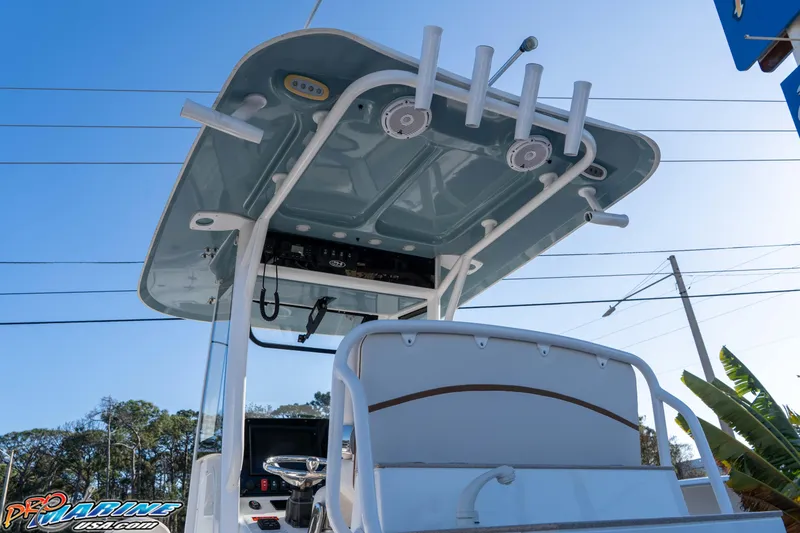 Slide: The Image of 2021 Sea Hunt Ultra 265 SE boat with T-top and rod holders, viewed from below. - 16