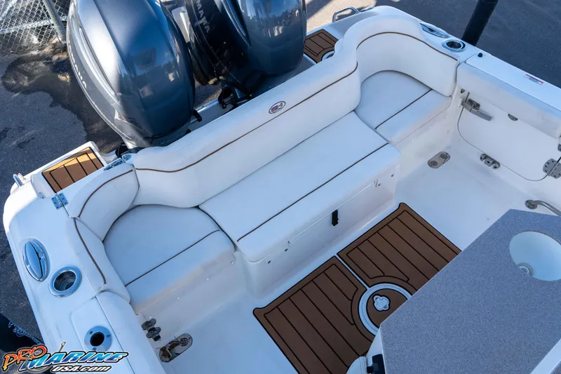 Slide: The Image of 2021 Sea Hunt Ultra 265 SE boat interior with seating and dual engines. - 19