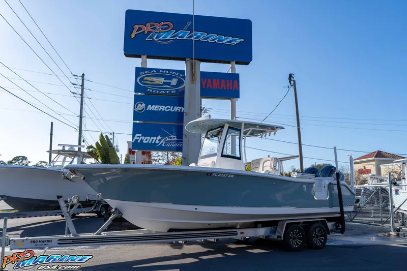 Slide: The Image of 2021 Sea Hunt Ultra 265 SE boat on trailer at Pro Marine dealership. - 2