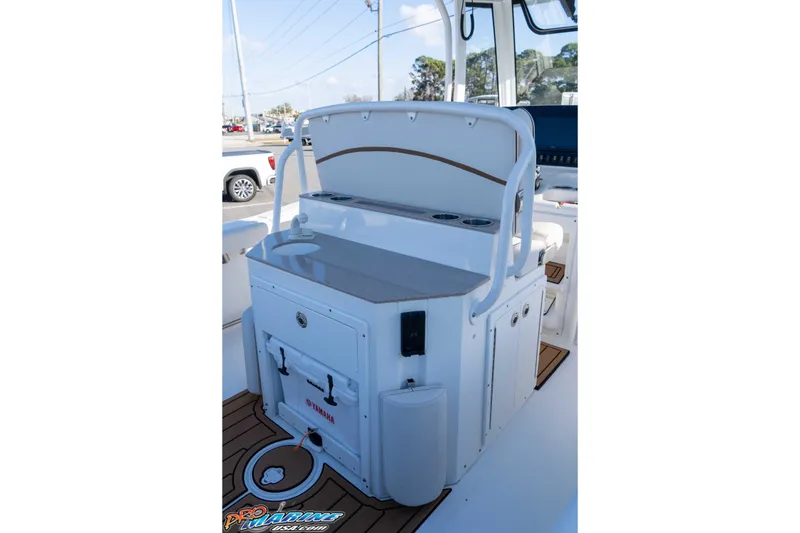 Slide: The Image of 2021 Sea Hunt Ultra 265 SE boat interior with console and storage compartments. - 21
