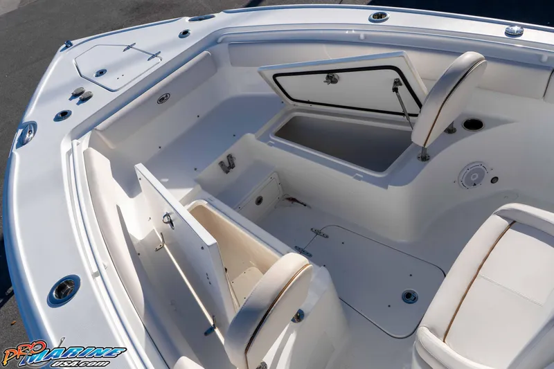 Slide: The Image of 2021 Sea Hunt Ultra 265 SE boat interior with open storage compartments. - 27