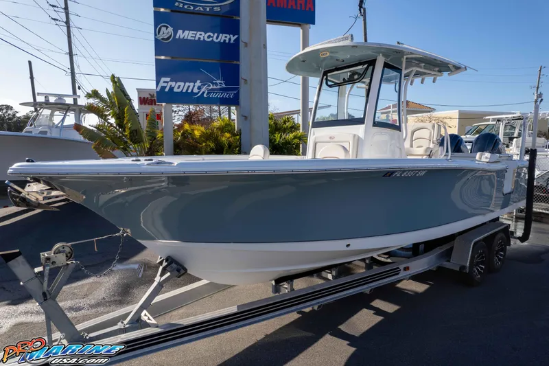 Slide: The Image of 2021 Sea Hunt Ultra 265 SE boat on trailer at dealership. - 31