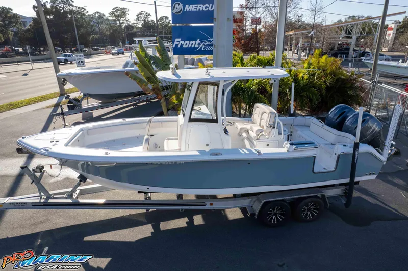 Slide: The Image of 2021 Sea Hunt Ultra 265 SE boat on trailer at dealership, side view. - 35