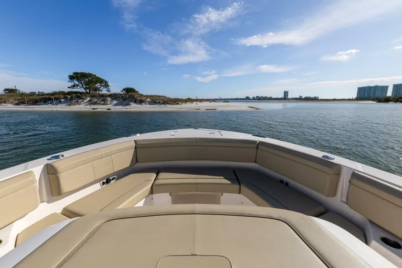 Slide: The Image of 2019 Pursuit S 368 Sport boat interior with scenic coastal view. - 17