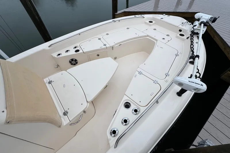Slide: The Image of 2022 Grady-White 251 Coastal Explorer boat deck with seating and storage compartments. - 12