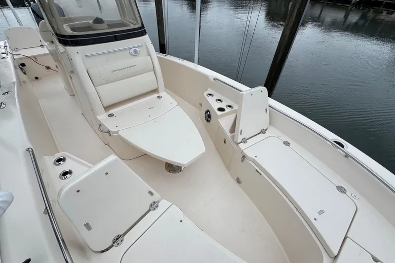Slide: The Image of 2022 Grady-White 251 Coastal Explorer boat interior with seating and storage compartments. - 14
