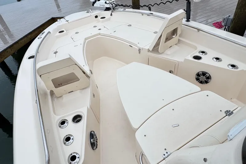 Slide: The Image of 2022 Grady-White 251 Coastal Explorer boat interior with seating and storage compartments. - 15