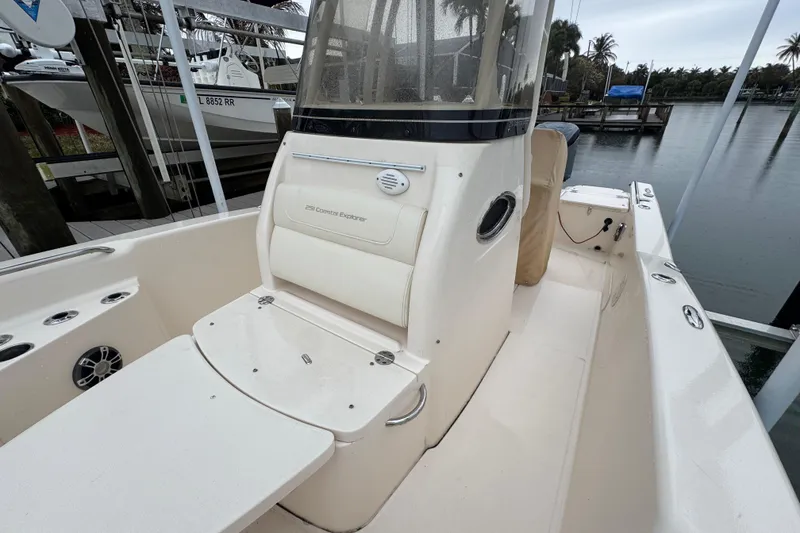 Slide: The Image of 2022 Grady-White 251 Coastal Explorer boat interior, featuring seating and console details. - 20