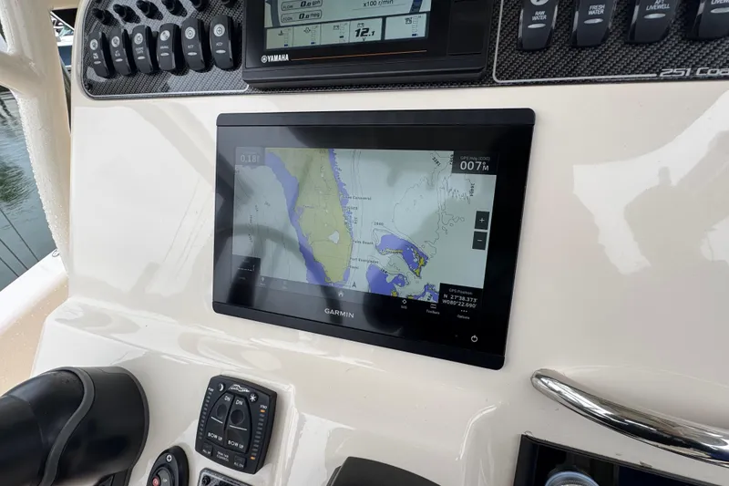 Slide: The Image of 2022 Grady-White 251 Coastal Explorer dashboard with Garmin navigation display. - 29