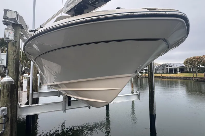 Slide: The Image of 2022 Grady-White 251 Coastal Explorer boat on lift by waterfront dock. - 3