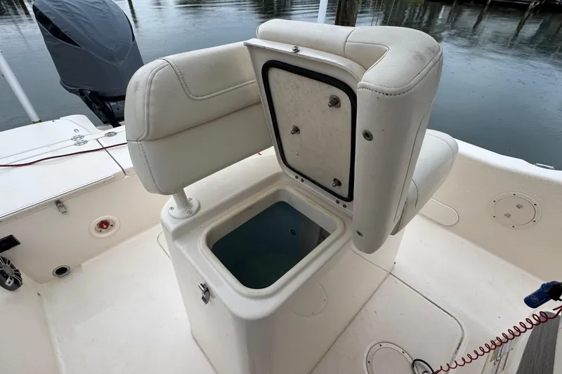 Slide: The Image of 2022 Grady-White 251 Coastal Explorer boat with open storage compartment on deck. - 39