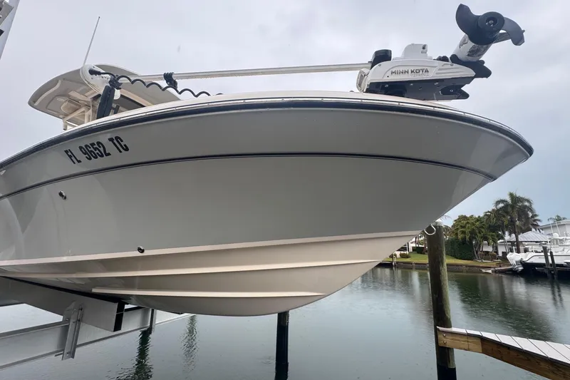 Slide: The Image of 2022 Grady-White 251 Coastal Explorer boat docked near water. - 4