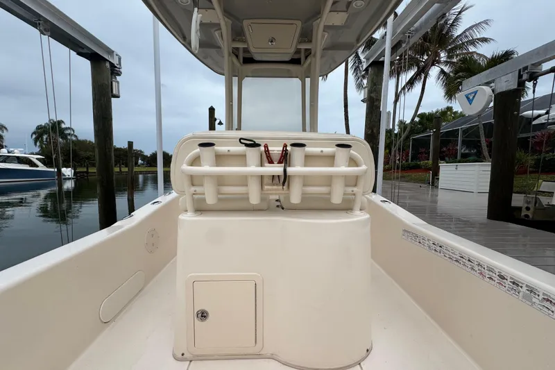 Slide: The Image of 2022 Grady-White 251 Coastal Explorer boat interior with rod holders and storage. - 44