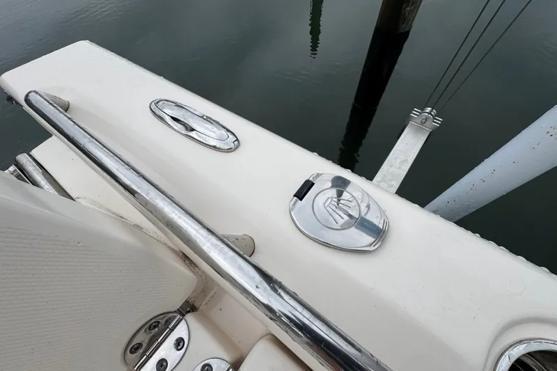 Slide: The Image of 2022 Grady-White 251 Coastal Explorer boat deck with chrome fittings and railing. - 45
