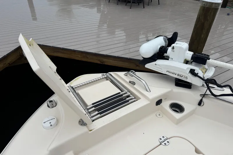 Slide: The Image of 2022 Grady-White 251 Coastal Explorer boat with Minn Kota trolling motor and deck ladder. - 50