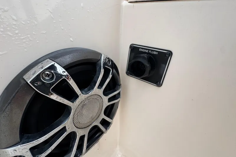 Slide: The Image of Speaker and engine flush port on 2022 Grady-White 251 Coastal Explorer boat. - 53