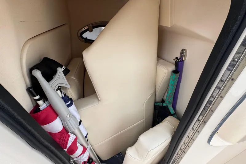 Slide: The Image of Interior storage of 2022 Grady-White 251 Coastal Explorer with flags and equipment. - 57