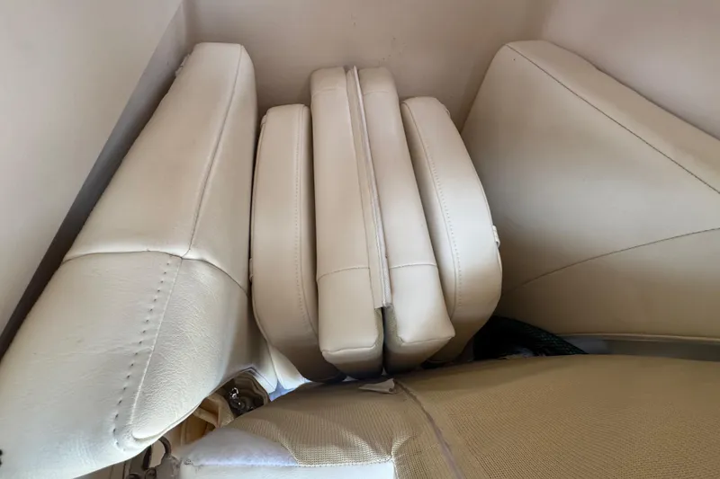 Slide: The Image of Cushioned seating on 2022 Grady-White 251 Coastal Explorer boat, featuring beige upholstery. - 58