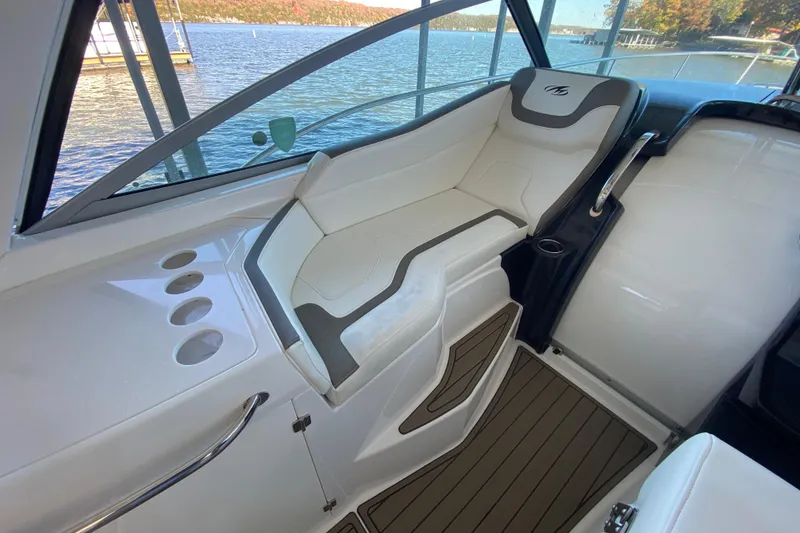 Slide: The Image of 2017 Monterey 355 Sport Yacht interior with white seating and lake view. - 10