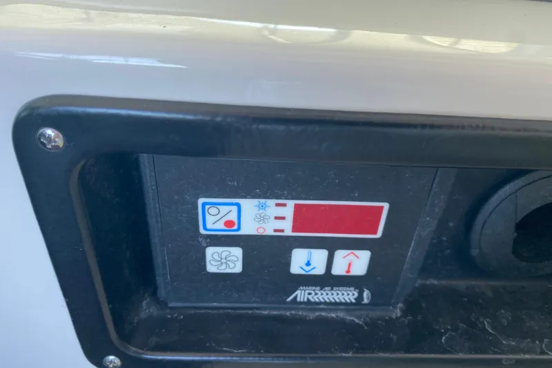 Slide: The Image of Control panel of a 2017 Monterey 355 Sport Yacht with temperature and fan settings. - 15