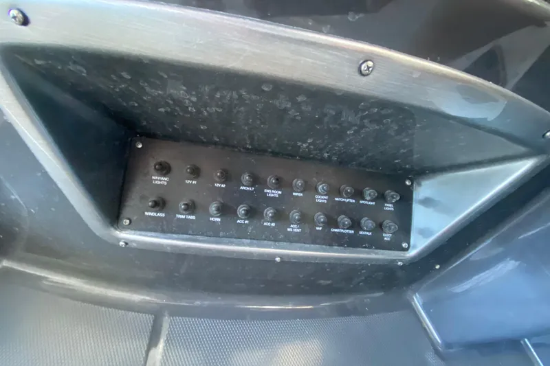 Slide: The Image of Control panel of a 2017 Monterey 355 Sport Yacht with various switches and labels. - 18