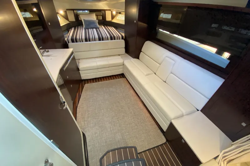 Slide: The Image of Luxurious interior of 2017 Monterey 355 Sport Yacht with modern seating and cozy bed. - 28