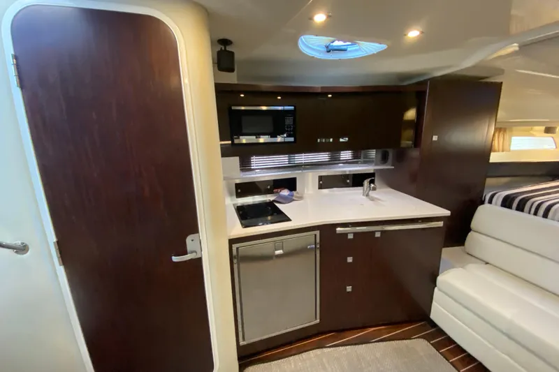 Slide: The Image of 2017 Monterey 355 Sport Yacht interior with modern kitchen and sleek cabinetry. - 29