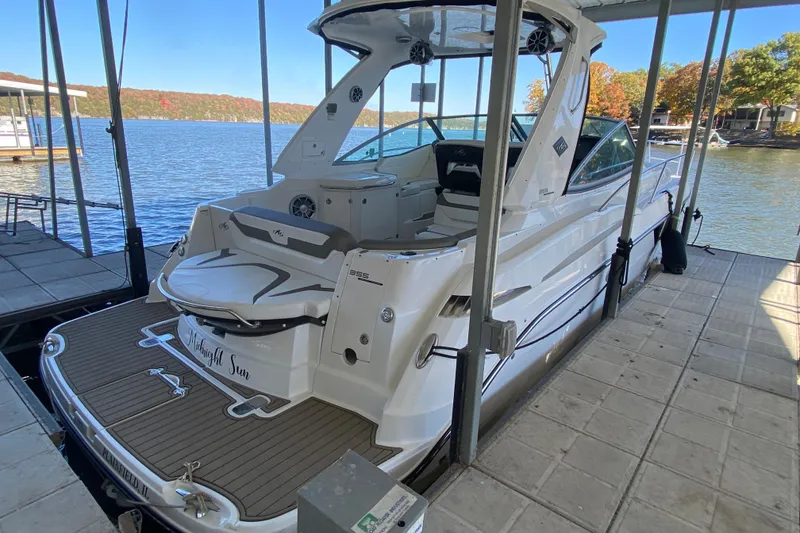 Slide: The Image of 2017 Monterey 355 Sport Yacht docked, showcasing sleek design and spacious deck. - 3