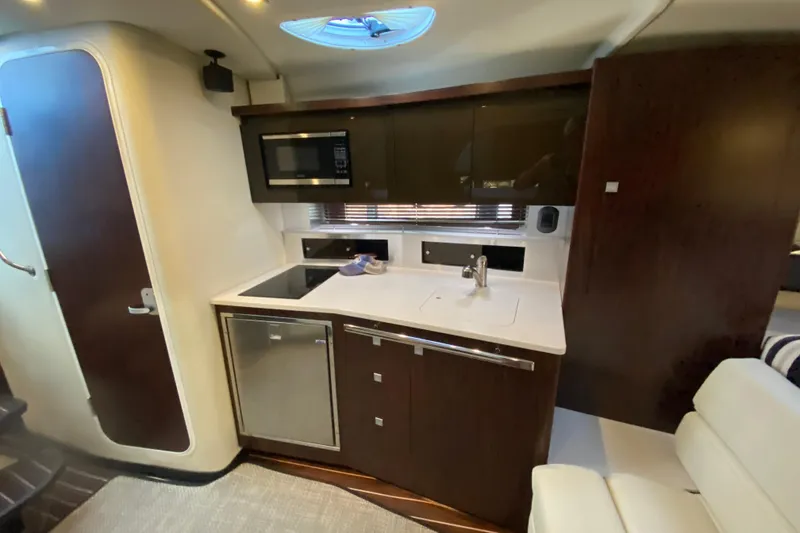 Slide: The Image of Luxurious 2017 Monterey 355 Sport Yacht interior kitchen with modern appliances and sleek design. - 30