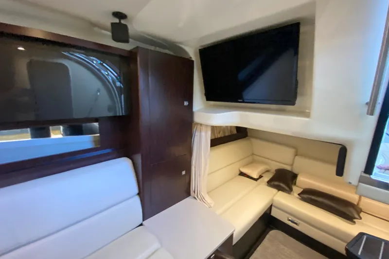 Slide: The Image of Interior of 2017 Monterey 355 Sport Yacht with modern seating and dual TVs. - 37