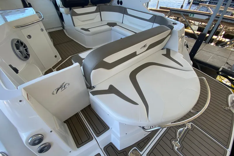Slide: The Image of 2017 Monterey 355 Sport Yacht interior with sleek seating and modern design. - 4