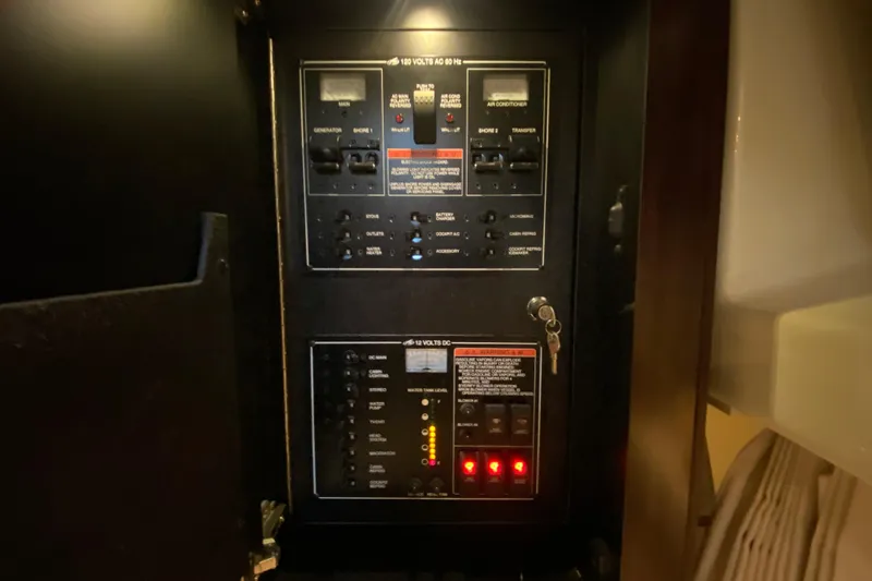 Slide: The Image of Electrical panel inside 2017 Monterey 355 Sport Yacht, featuring various switches and controls. - 41