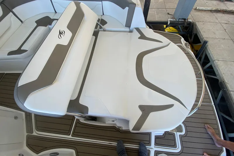 Slide: The Image of 2017 Monterey 355 Sport Yacht interior with white and brown seating on deck. - 5