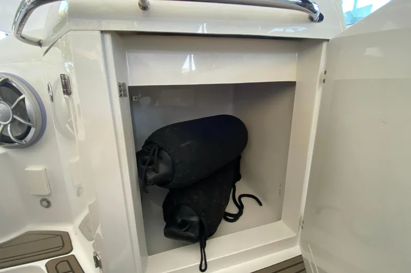 Slide: The Image of Storage compartment on 2017 Monterey 355 Sport Yacht with black fenders inside. - 51