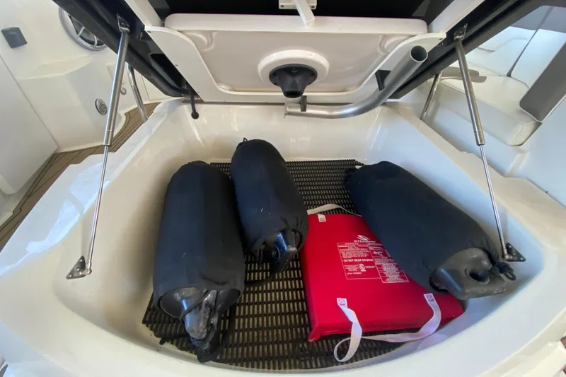 Slide: The Image of Storage compartment of 2017 Monterey 355 Sport Yacht with fenders and safety equipment. - 52