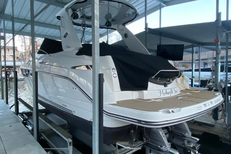 Slide: The Image of 2017 Monterey 355 Sport Yacht docked in a covered marina. - 55