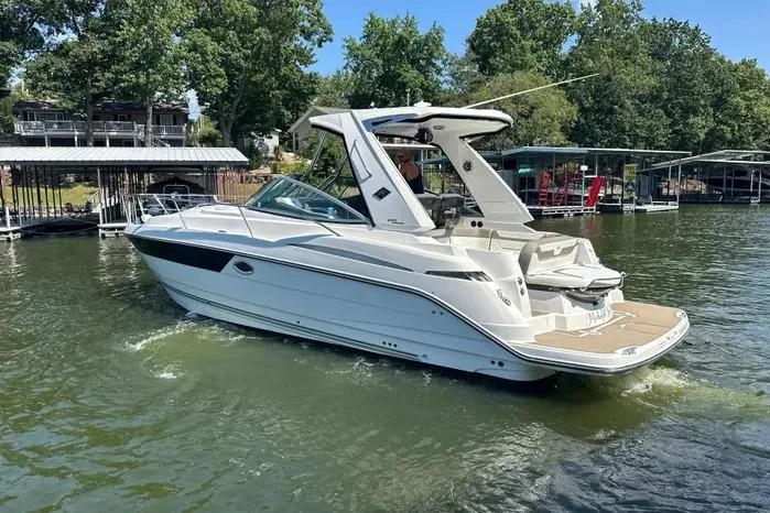 Slide: The Image of 2017 Monterey 355 Sport Yacht on a serene lake, surrounded by lush greenery. - 61