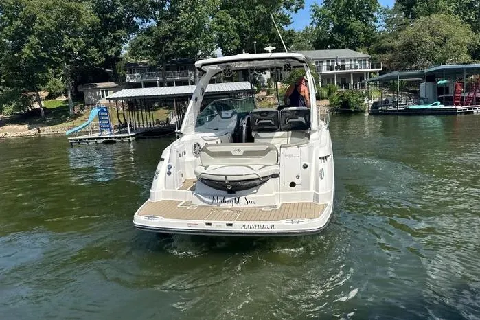 Slide: The Image of 2017 Monterey 355 Sport Yacht on a lake, surrounded by docks and trees. - 63
