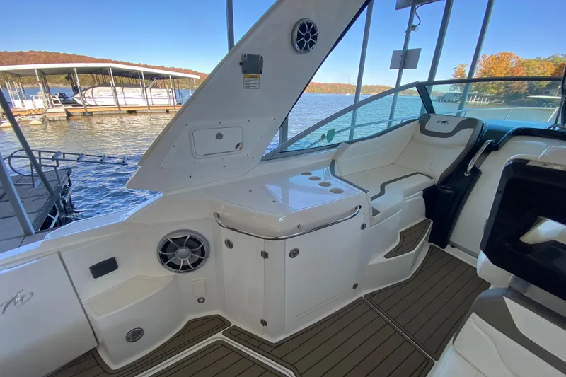 Slide: The Image of 2017 Monterey 355 Sport Yacht interior with seating and lake view. - 7