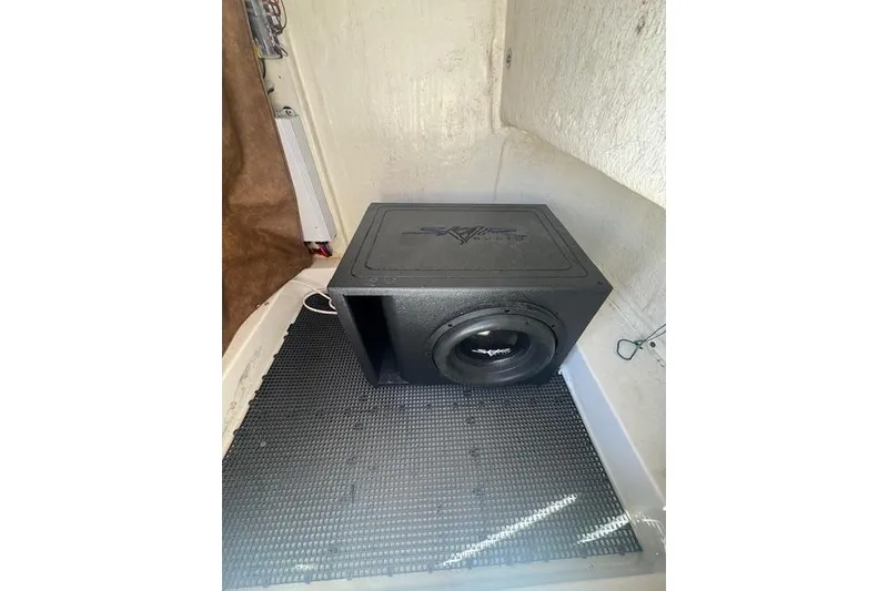 Slide: The Image of Subwoofer installed in 2022 Sea Pro 248 Bay boat interior. - 4