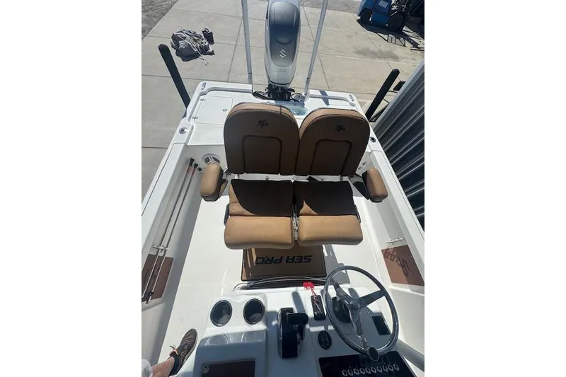 Slide: The Image of 2022 Sea Pro 248 Bay boat interior with dual seats and steering console. - 6