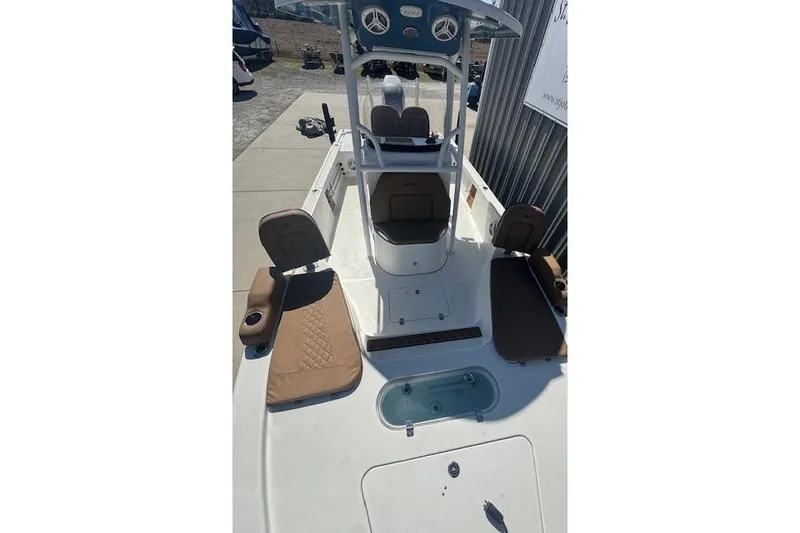 Slide: The Image of 2022 Sea Pro 248 Bay boat interior with seating and console. - 7