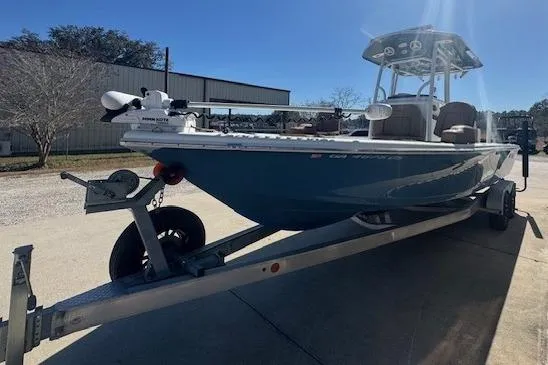 Slide: The Image of 2022 Sea Pro 248 Bay boat on trailer, parked outdoors in sunny setting. - 9