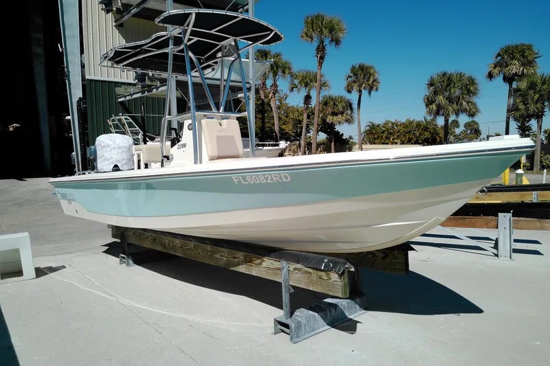 The Image of 2016 Pathfinder 2200 T boat on display with palm trees in the background. - 1