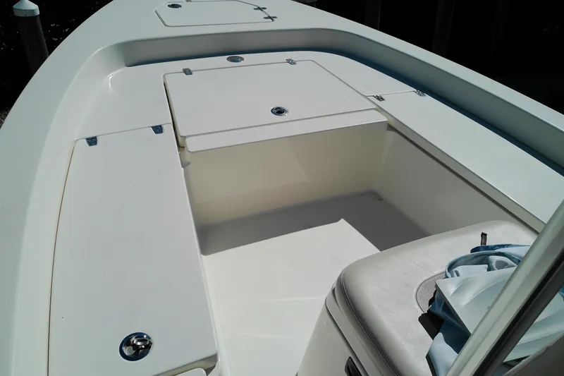 Slide: The Image of 2016 Pathfinder 2200 T boat interior with storage compartments and seating. - 18