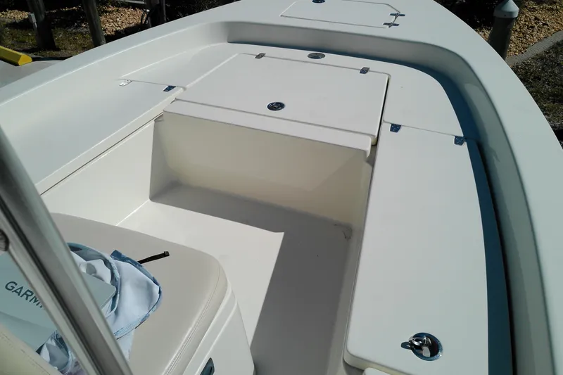 Slide: The Image of 2016 Pathfinder 2200 T boat interior with storage compartments and seating. - 19